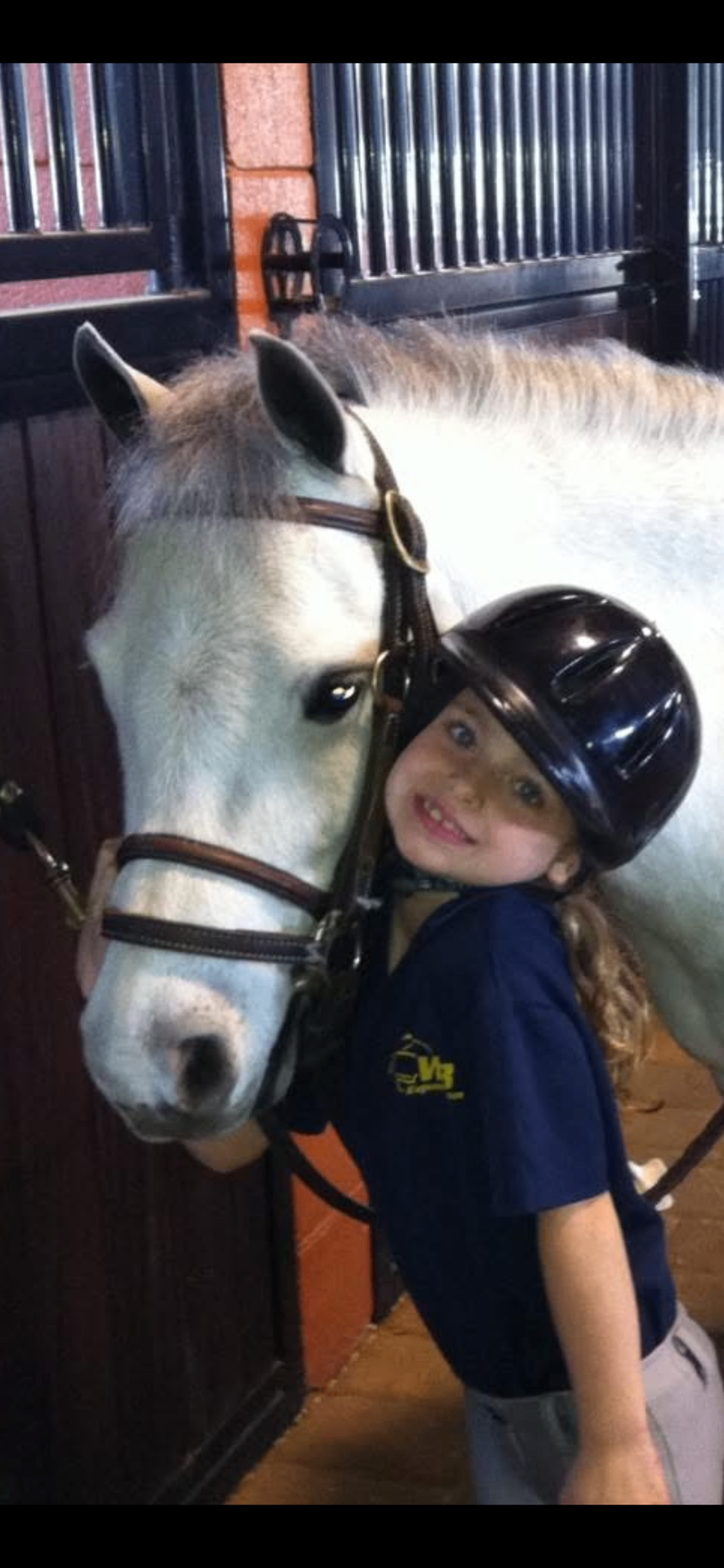 A young Sophia with her first pony